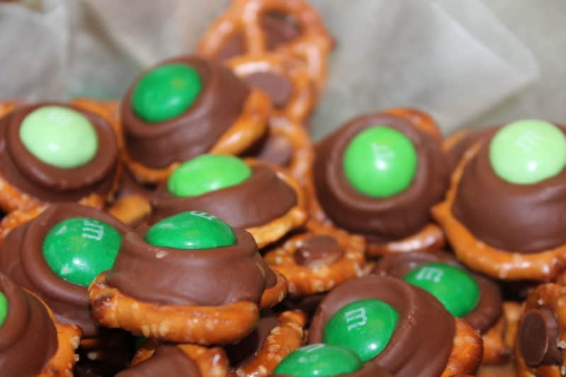 close up image of Rolo Pretzels with green mint m&ms