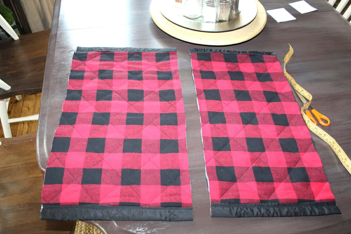 Preparing buffalo check fabric for sewing project.