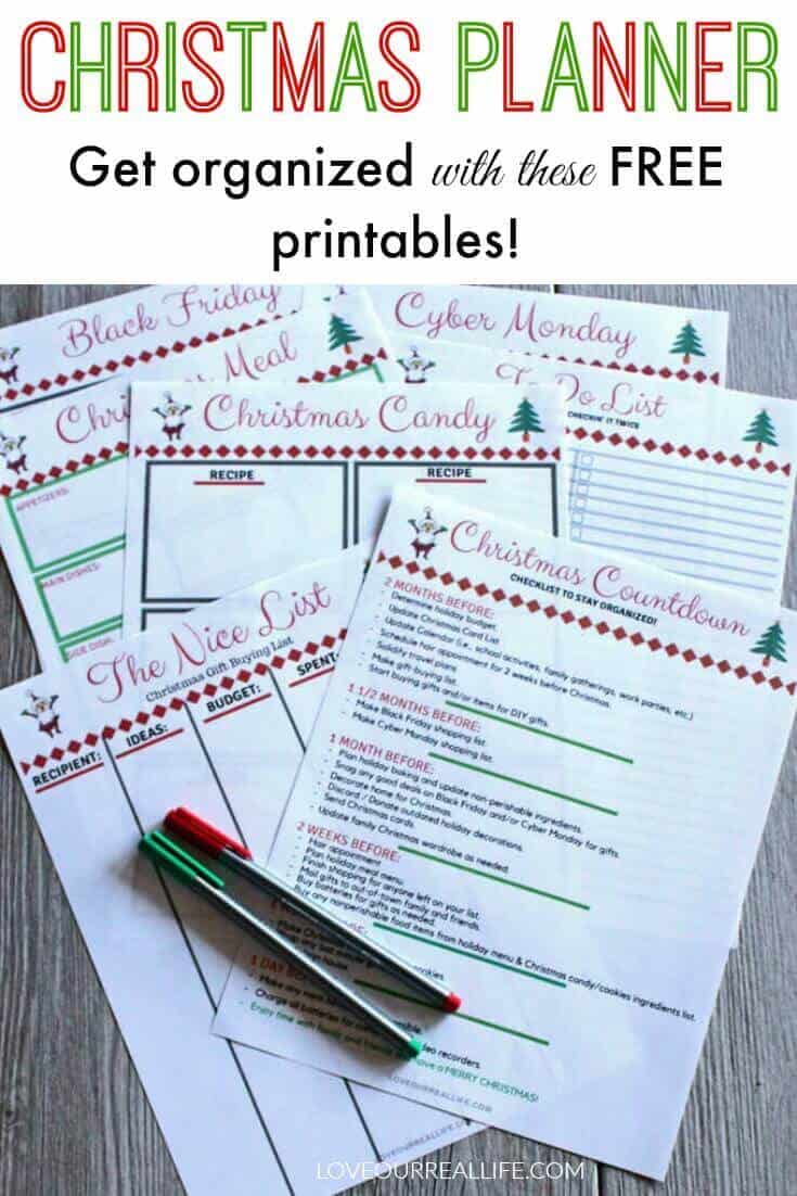 Christmas planner printable pages with red and green pen on rustic wood board.