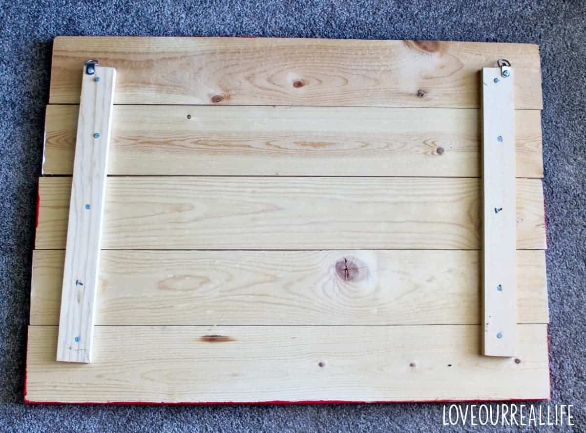 The back of a wood pallet used for decorative American flag sign.