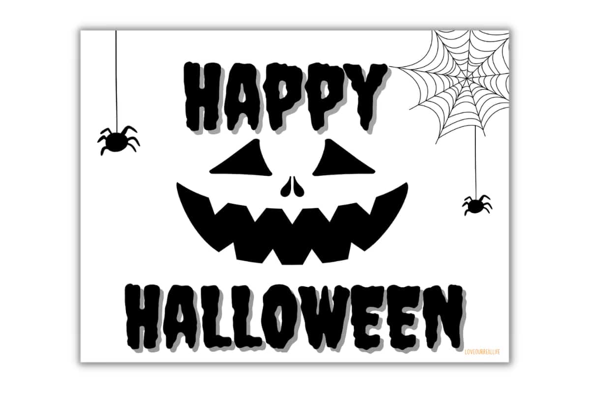 Jack o'lantern face and spiders on Halloween sign.