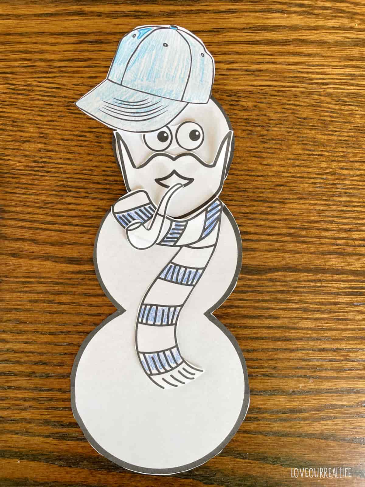Santa cutout build a snowman craft.