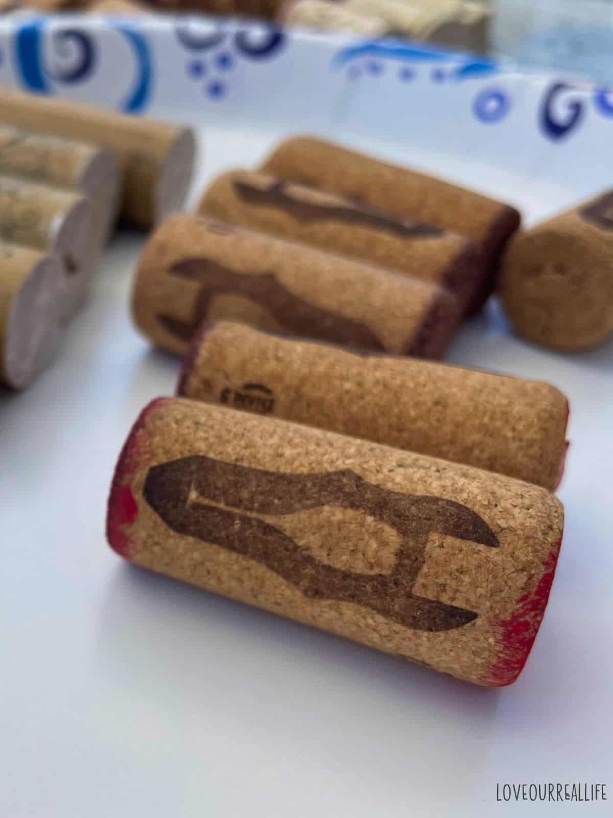 Ends of wine corks painted in red.