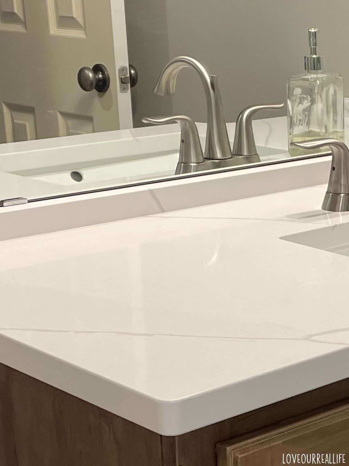 Calacatta Ultra Quartz used on bathroom vanity countertop.