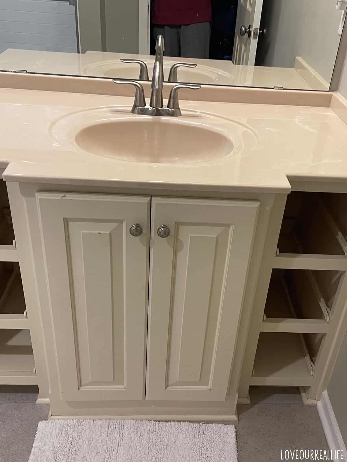 Cream yellow vanity.