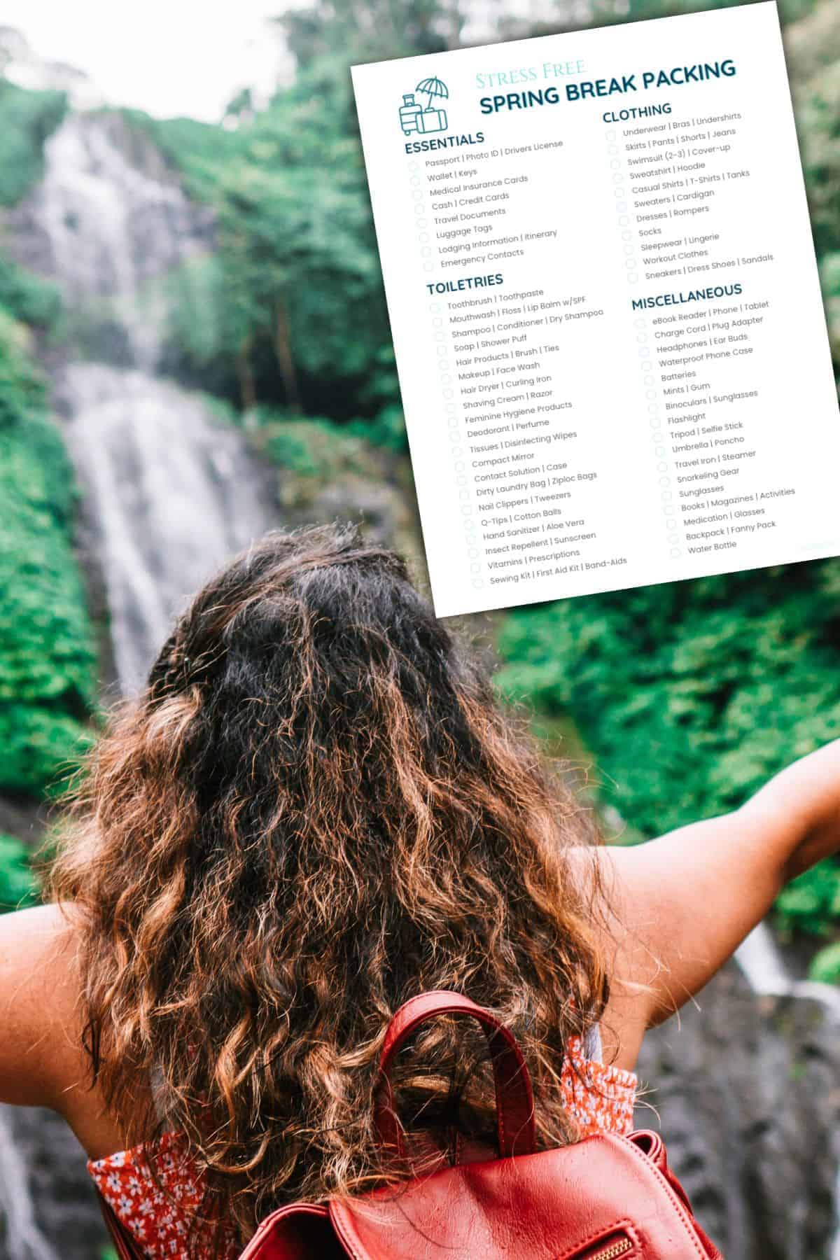 Young female adult looking at waterfall.