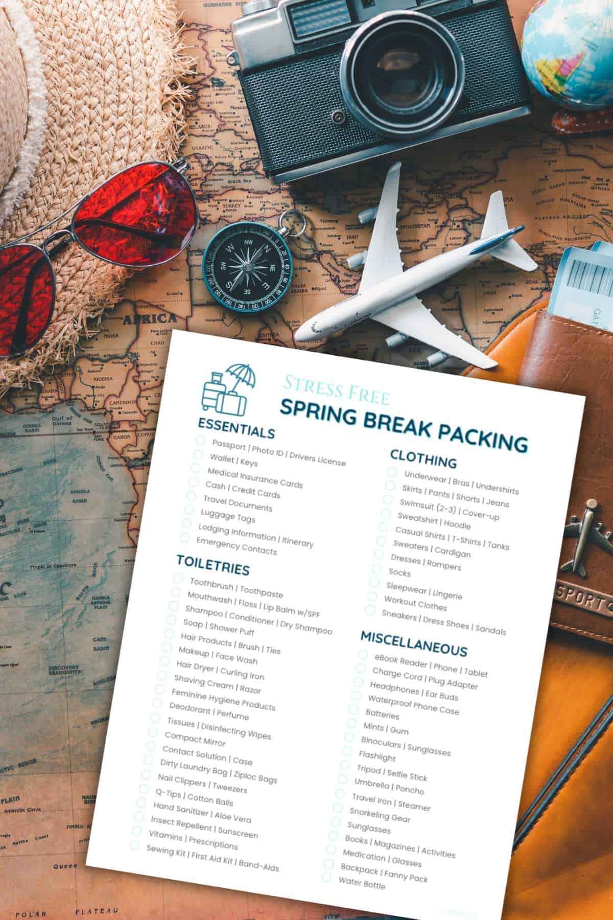 Travel items in background with spring break packing list overlay.